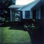 Right side showing Peggy's wrap-around flower bed. 702 Marion Street, Kings Mountain, North Carolina. Circa 1975.